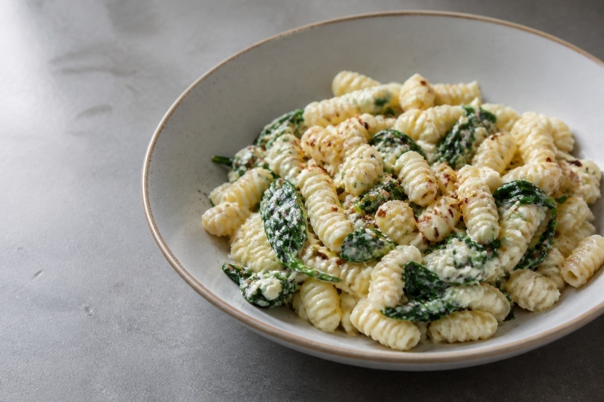 Creamy cottage cheese pasta with spinach and chili flakes