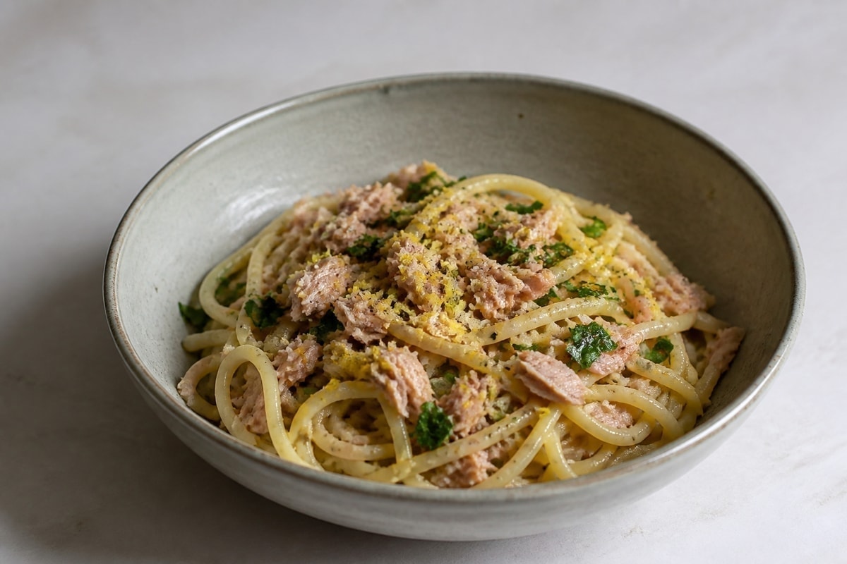 Tuna pasta with peas, lemon, and garlic in a bowl